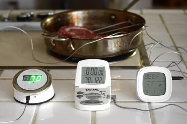 three thermometers in steak