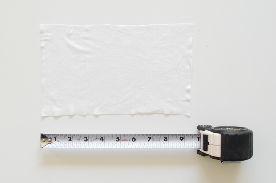tape measuring a baby wipe