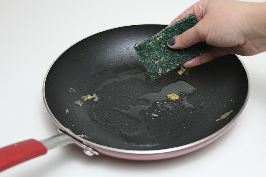 synthetic steel wool scrubbing a pan