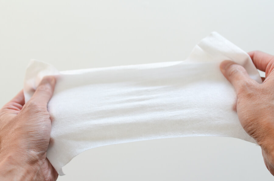 two hands administering the tug test