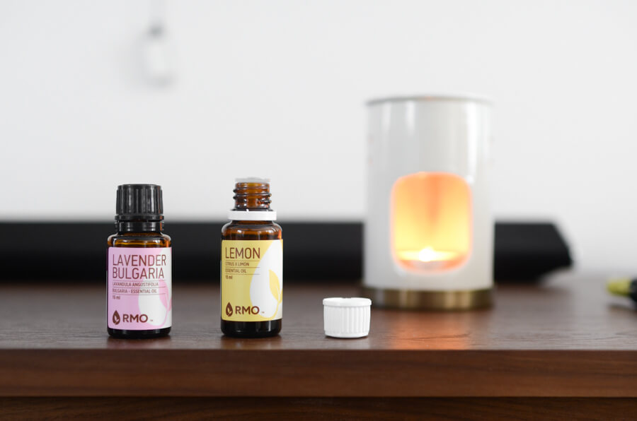 essential oil diffuser next to two bottles