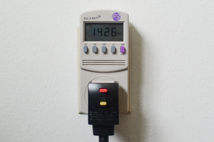 wattage meter with a hair dryer plugged in