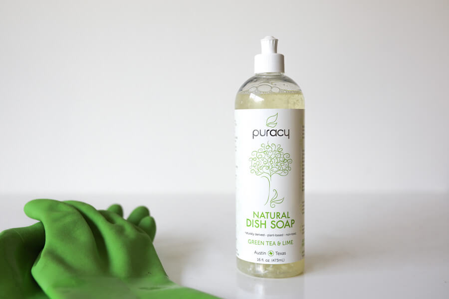 bottle of Puracy next to gloves