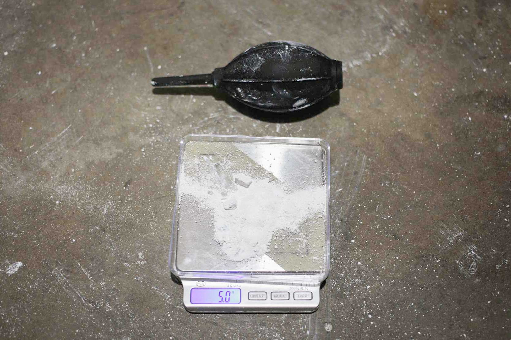 weighing titanium dioxide on a scale