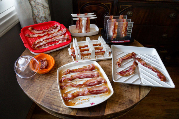 Group of microwave bacon cookers on table