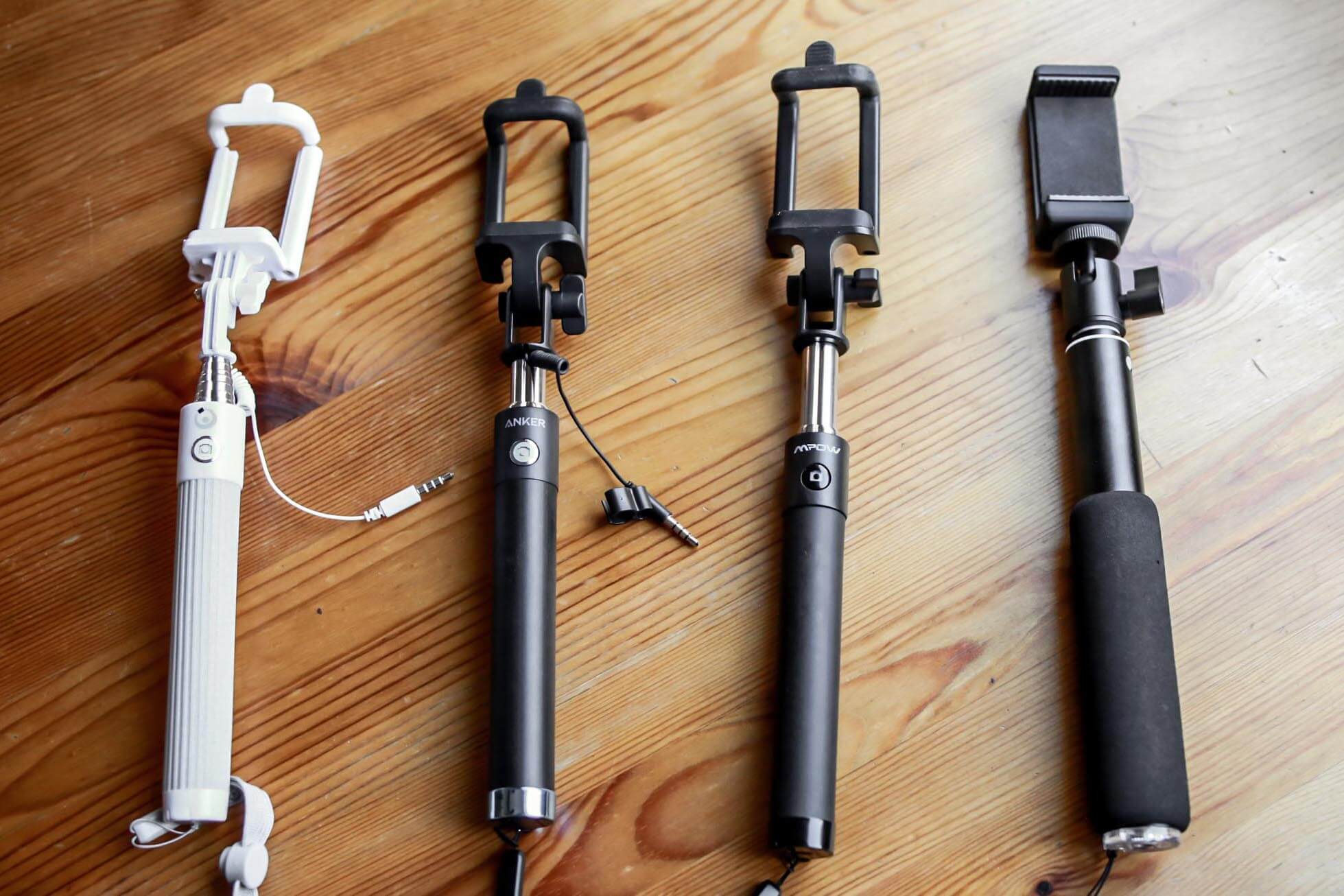 Selfie sticks on wood background
