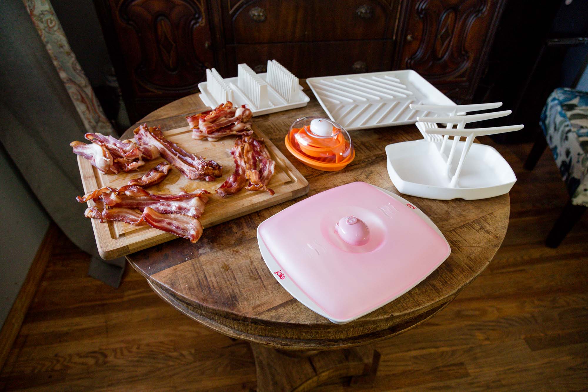 Four runner-up bacon cookers on table