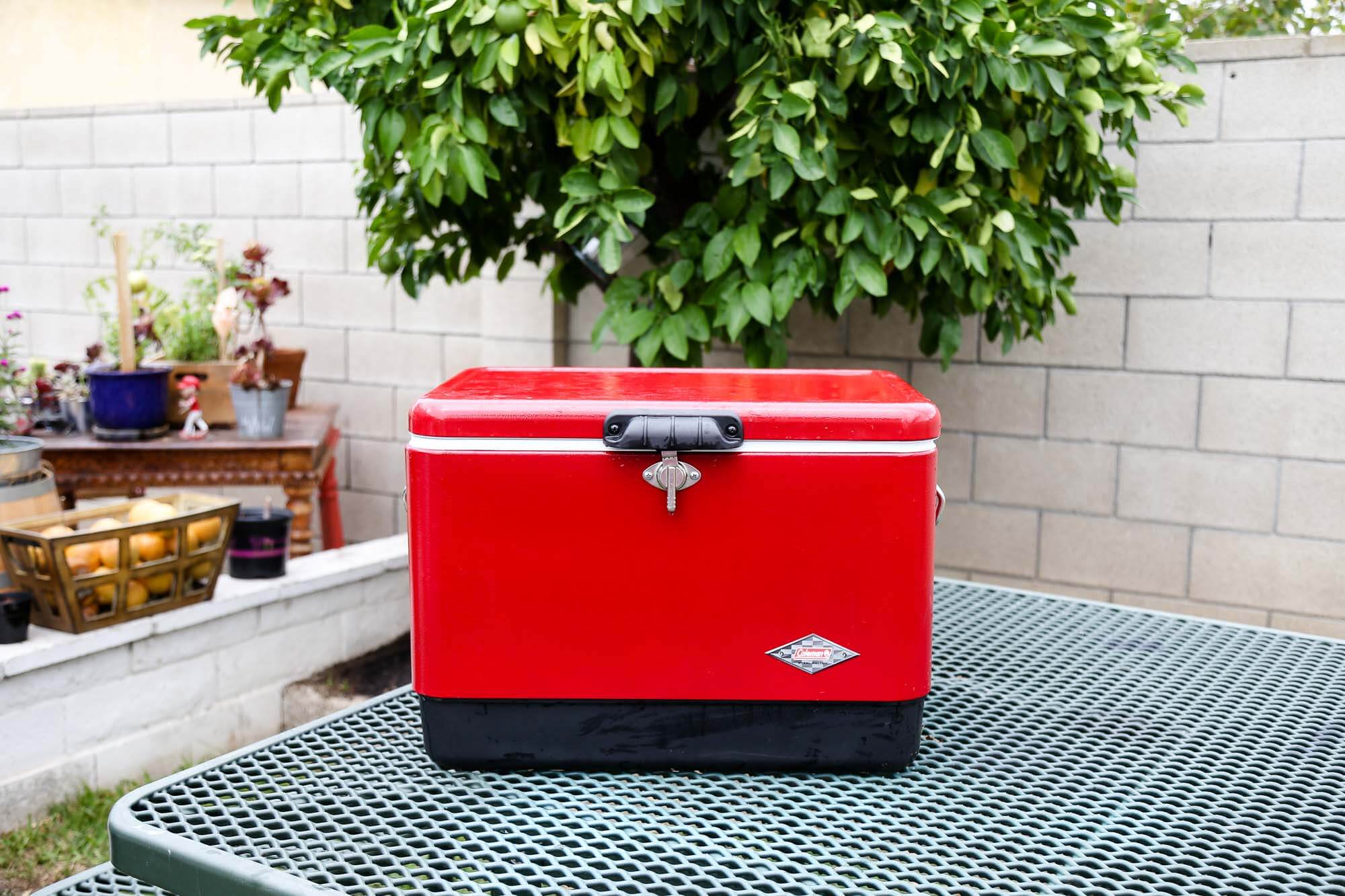 a red Coleman - Steel-belted cooler