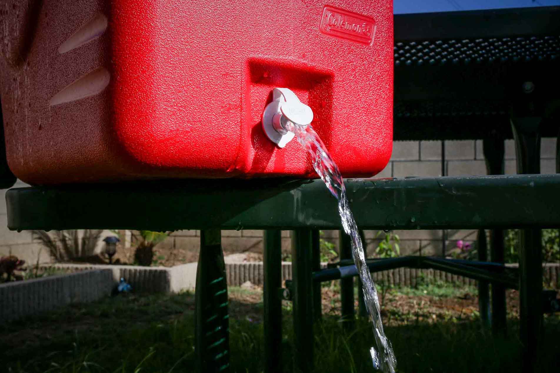 spout of a cooler draining water