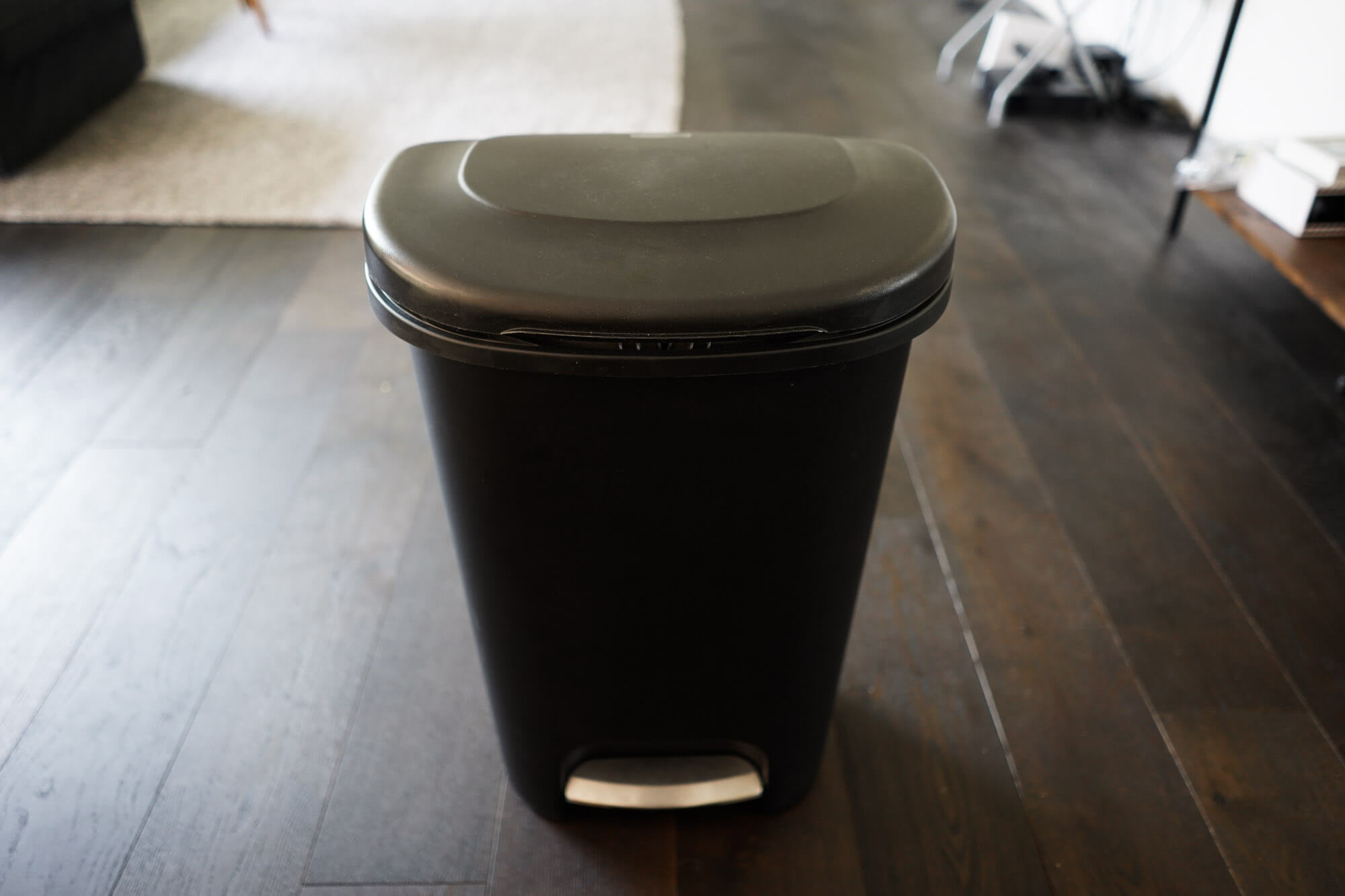Rubbermaid black plastic trash can