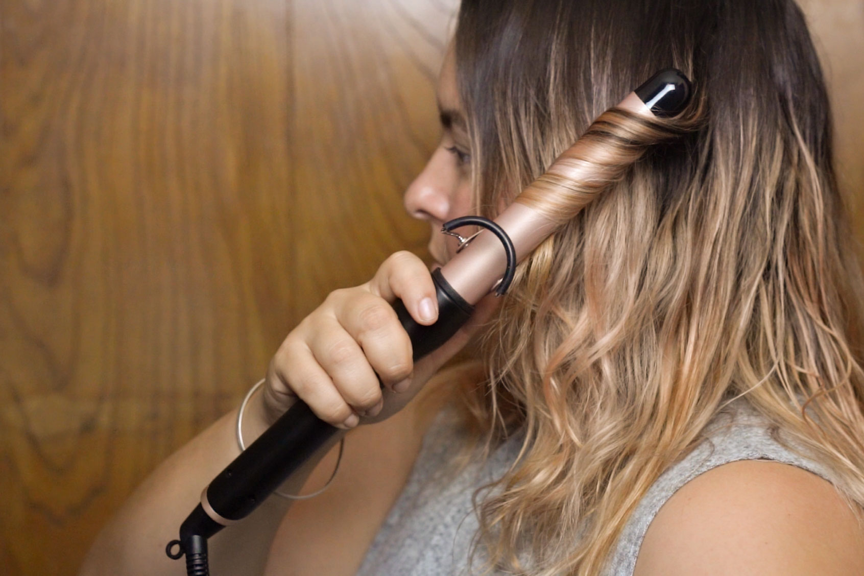 Woman using a curling iron