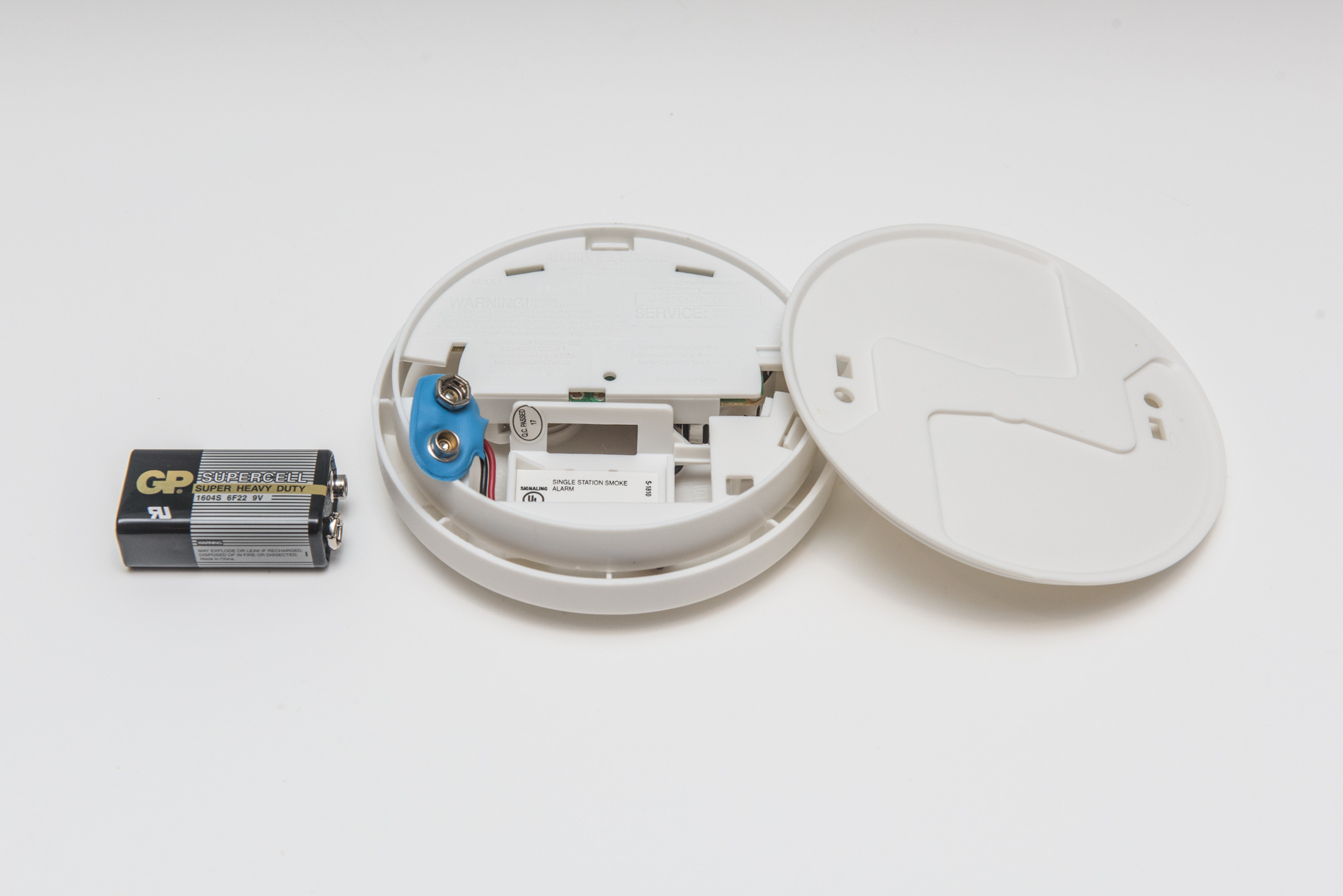 Smoke detector with battery removed at side