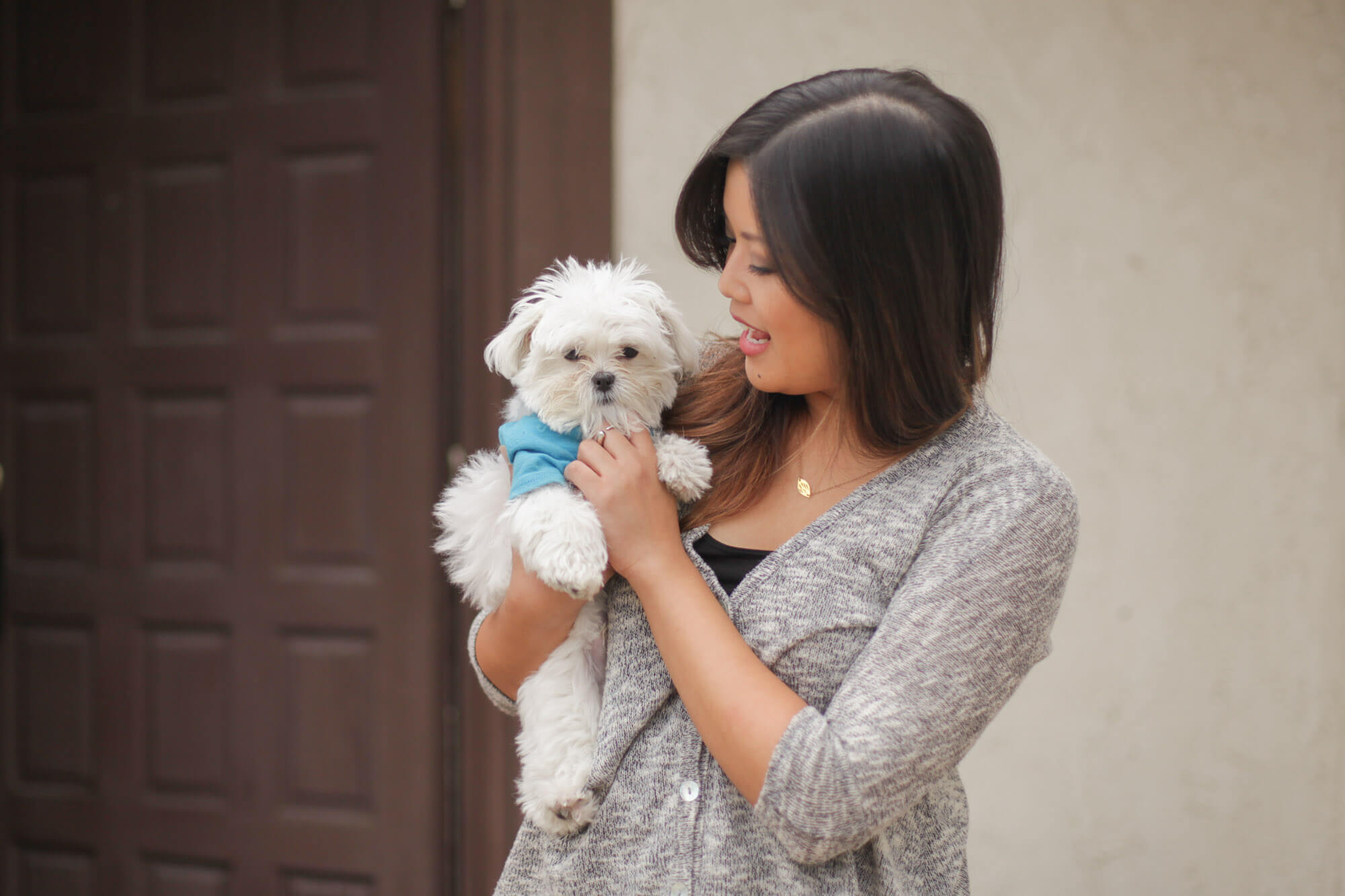 Woman holding small dog