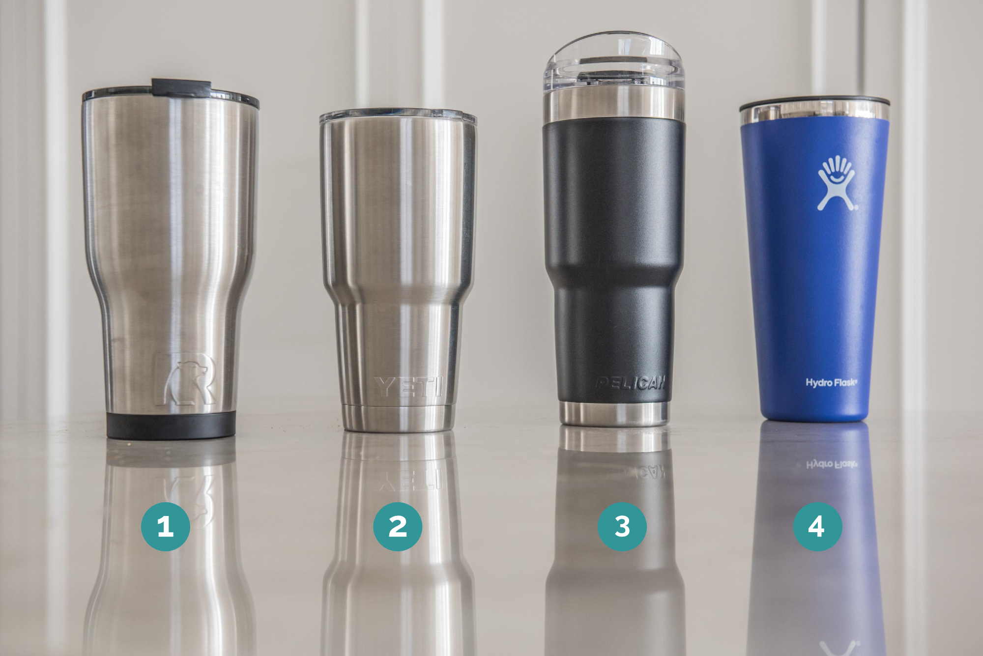 Four tumblers with numbers below