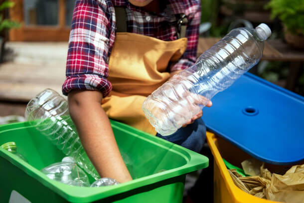 boy going through recycling