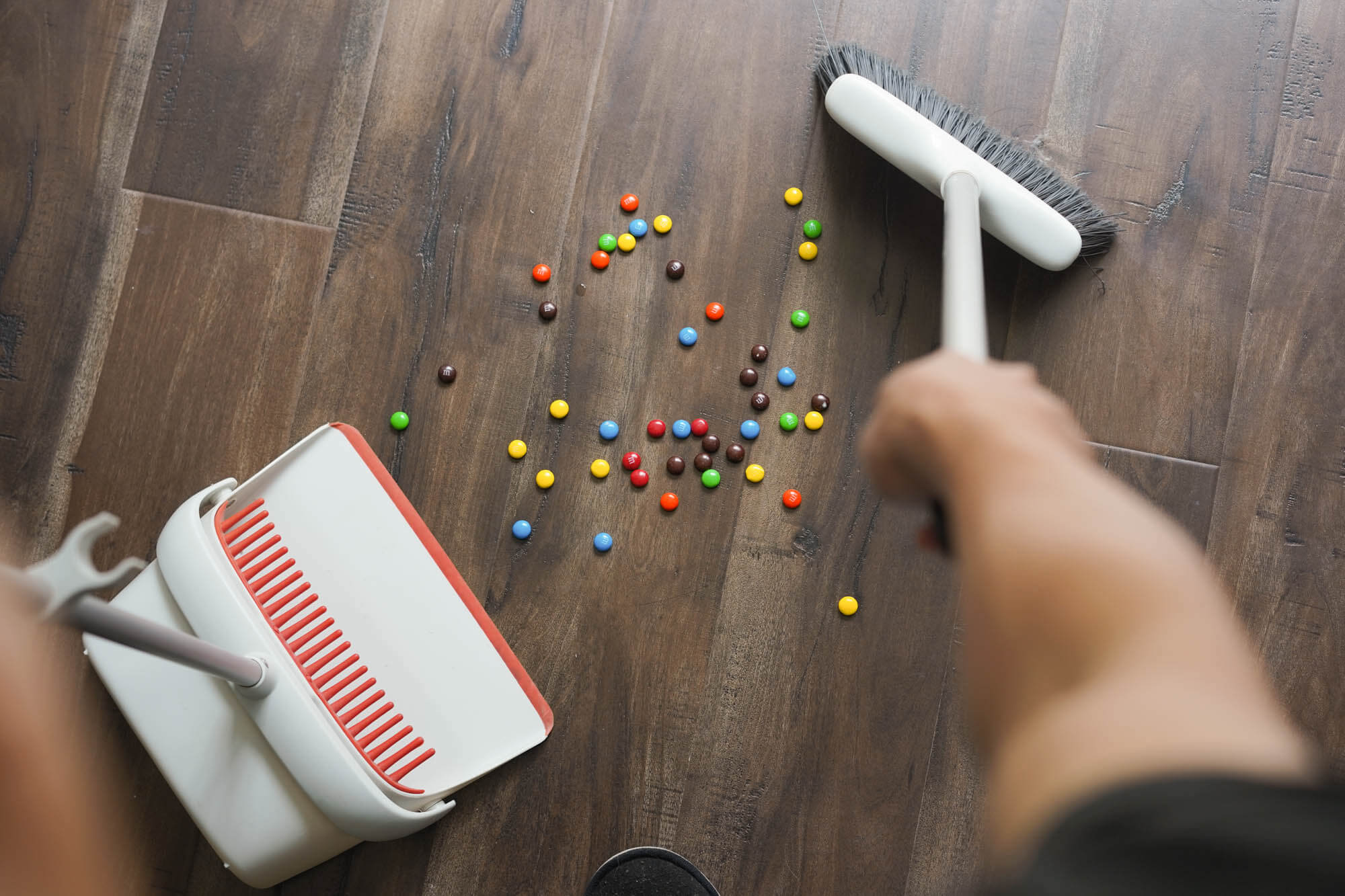 sweeping skittles off floor
