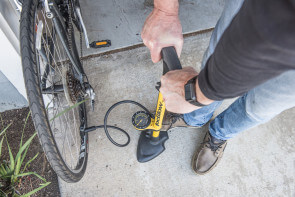 pumping up a bike tire