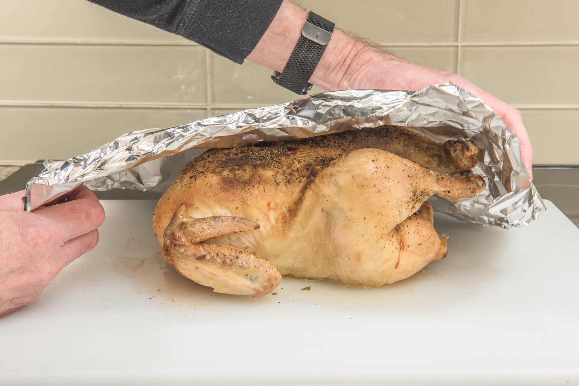 covering chicken with foil to rest