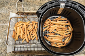 french fries in fry basket and air fryer basket