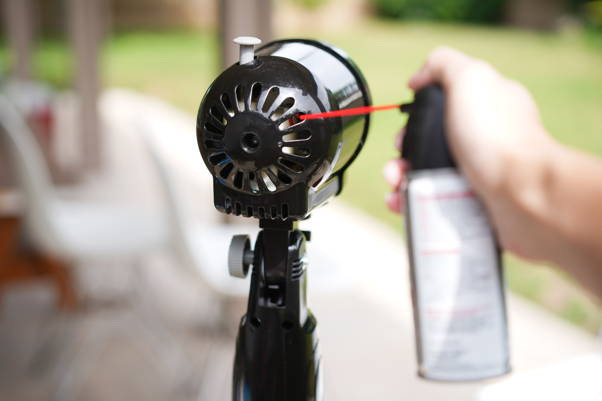 spraying rear fan motor with compressed air