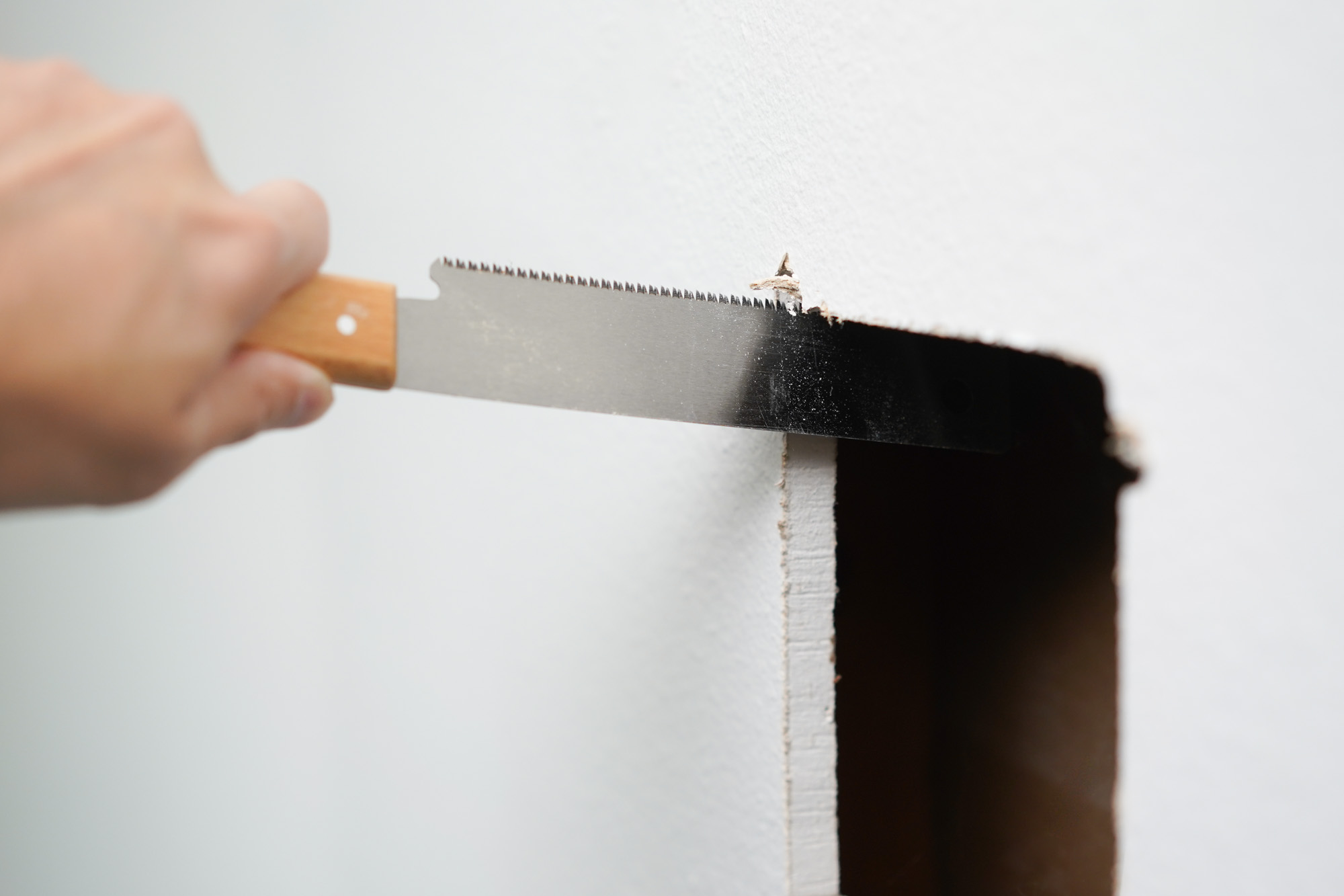 cutting a hole in drywall