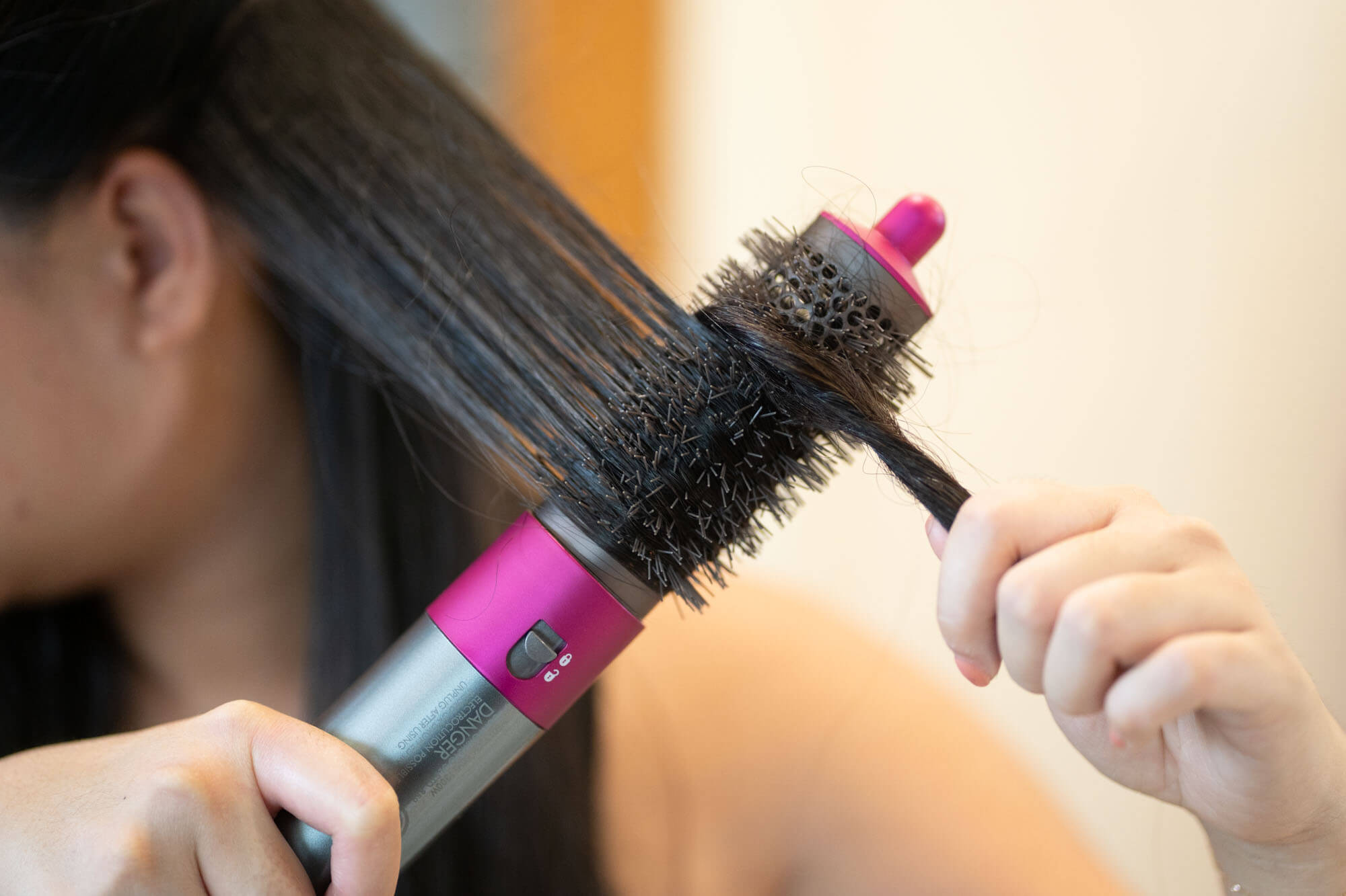hair wrapped around Dyson round volumizing brush
