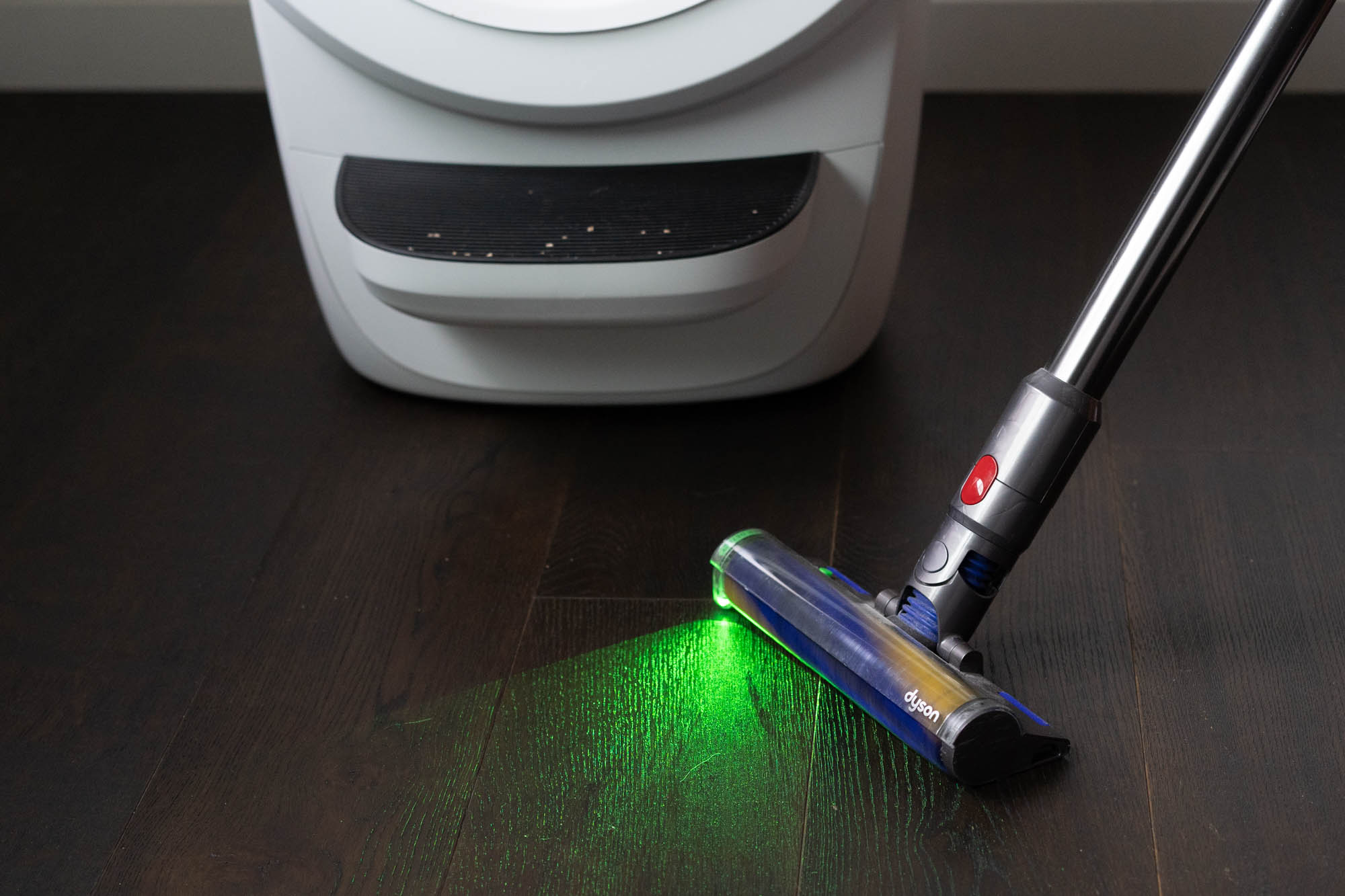 vacuuming floor near Litter-Robot 4